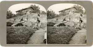 1912 stereograph showing construction scene of a hillside house near Silver Lake Reservoir, with dirt grading in foreground.