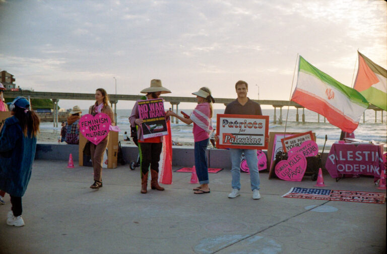 protesters with flags at Ocean Beach San Diego pier, Yashica Electro 35 street photography