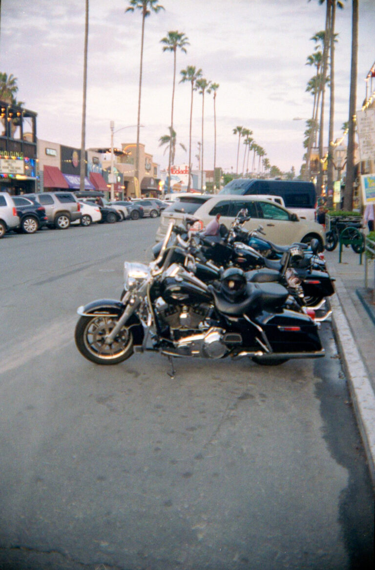 Harley Davidson motorcycles parked on Newport Avenue Ocean Beach San Diego, Yashica Electro 35