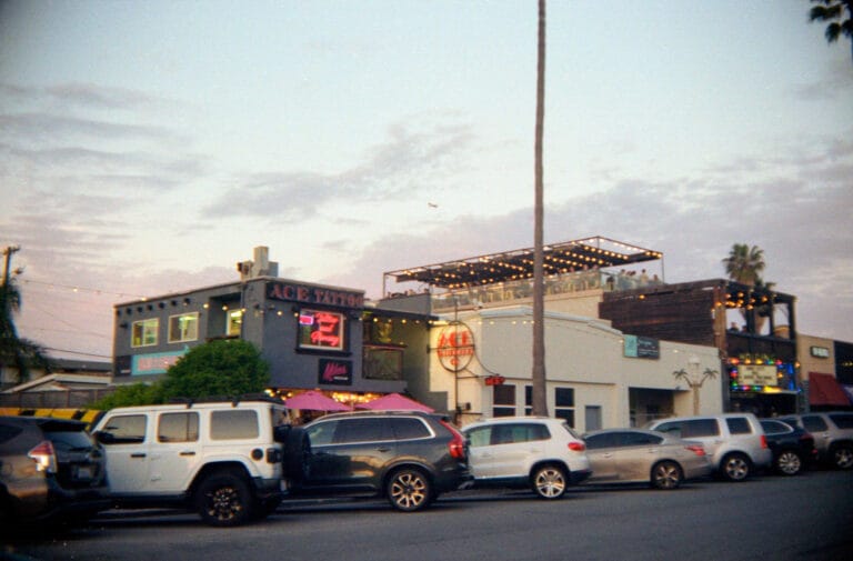 motorcycles parked on Newport Avenue Ocean Beach San Diego with Ace Tattoo shop, Yashica Electro 35