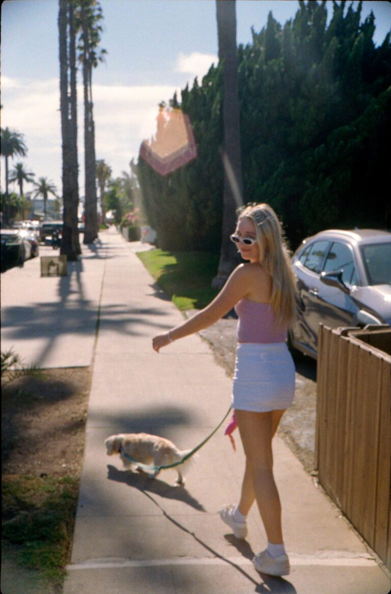 blonde woman walking golden dachshund on palm tree lined sidewalk Pacific Beach San Diego, Yashica Electro 35