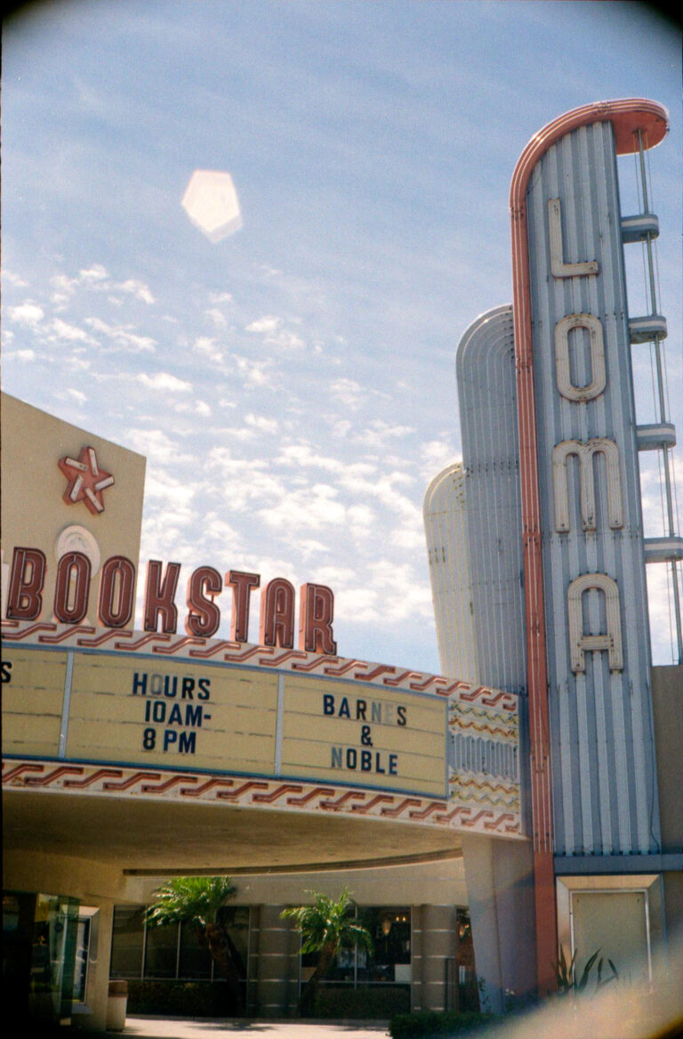 Bookstar Loma Theatre sign in Ocean Beach San Diego with lens flare, Yashica Electro 35 film photography