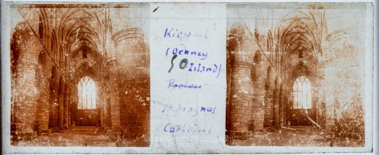 Vérascope Richard glass slide captioned "Kirkwall (Orkney Island) – St Magnus Cathedral" showing the Romanesque nave interior with ribbed vaulting and stone arches in Kirkwall, Orkney, Scotland. From Empress Eugenie Verascope Richard collection.