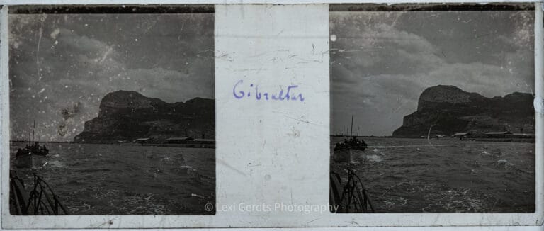 Stereoscopic glass slide captioned "Gibraltar – Le Rocher" showing the Rock of Gibraltar rising from the sea, photographed from a boat in the harbor, circa early 1900s. From Empress Eugenie Verascope Richard collection.