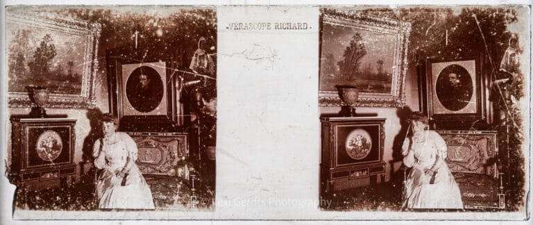 Antique 45x107mm Vérascope Richard stereoscopic glass plate showing a woman in white posed among Bonaparte family portraits in the gallery at Farnborough Hill, Empress Eugénie's estate in Hampshire. From Empress Eugenie Verascope Richard collection.