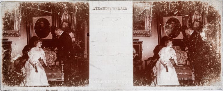 Vérascope Richard 45x107mm stereoscopic glass slide of a woman in white in the Bonaparte portrait gallery at Farnborough Hill, Hampshire, with gilt-framed paintings and ornate furniture, circa 1907–1920. From Empress Eugenie Verascope Richard collection.