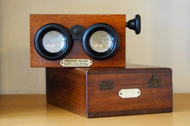 Verascope Richard Stereoscopic 3D Viewer stacked on top of a Box of stereoscopic glass slides