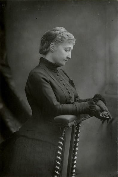 Empress Eugénie, photographed by W. & D. Downey, c. 1880. After the deaths of Napoleon III and her son, she wore mourning dress for the rest of her life. (Public domain, Wikimedia Commons)