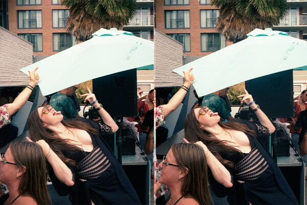 Stereo pair of a woman in black celebrating under white umbrellas at the Hard Rock San Diego party.